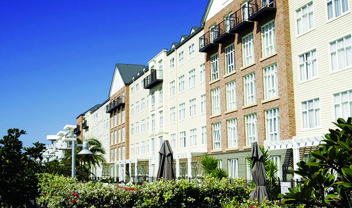 apartment-blocks-bricks-balcony-garden-in-front