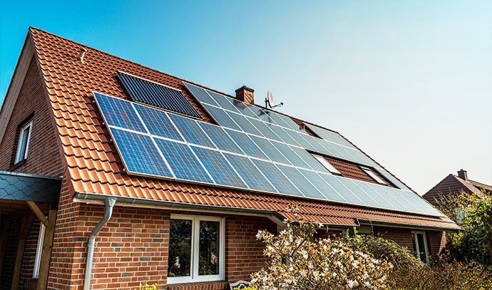 solar-panels-on-roof-brick-house-red-roof