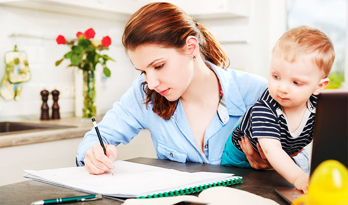 woman-working-at-home-with-kid