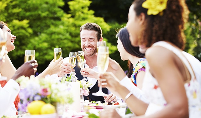 friends-outdoor-dinner-champagne-toast-gathering