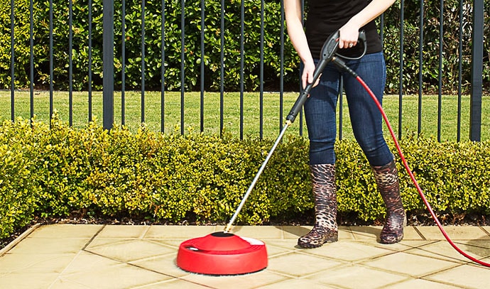 pressure-washer-lady-cleaning-outdoor-tiles