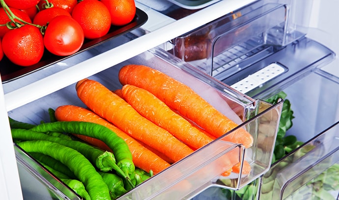 open-fridge-veggies-carrots-tomatoes-peppers
