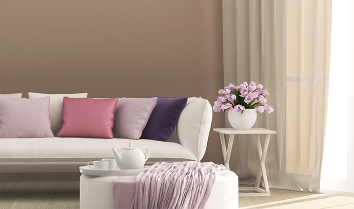 french-modern-living-room-seating-area-pink-lavender-flowers-couch-pillows