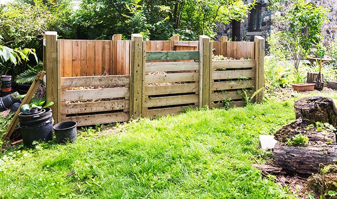 wooden-compost-bins-in-garden-setting
