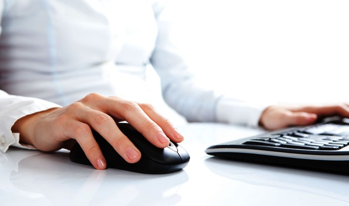 woman-hands-on-mouse-and-keyboard-using-computer