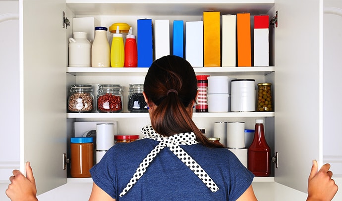 woman-opening-food-pantry-cupboard