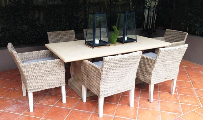 outdoor-elegance-stone-table-and-woven-chairs