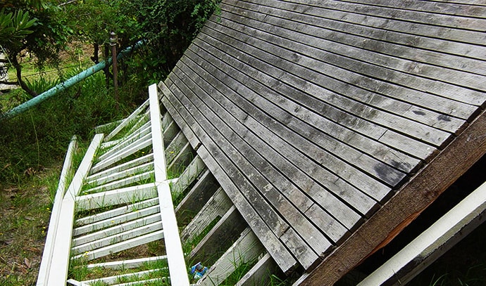 damaged-balcony-wreck-wooden-deck