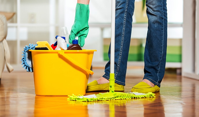 female-cleaning-tiles-floor-using-mop