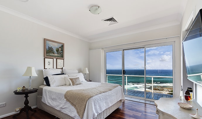 modern-bedroom-white-overlooking-beach-view