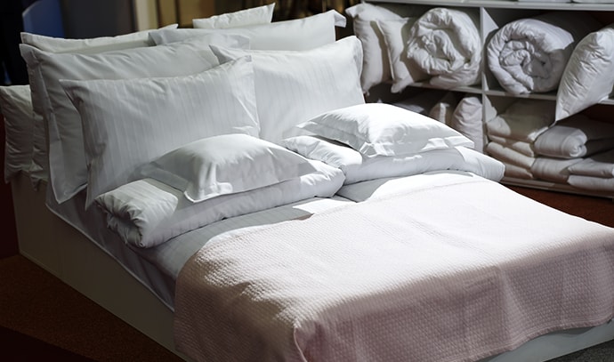 making-bed-white-sheets-pillow-mattress