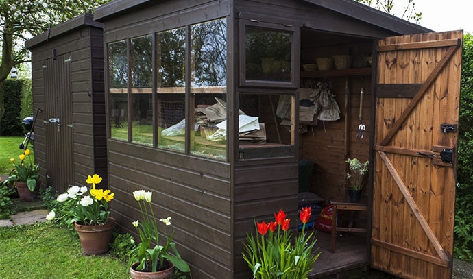 garden-shed-exterior-door-open-tools-flowers-plant-pots