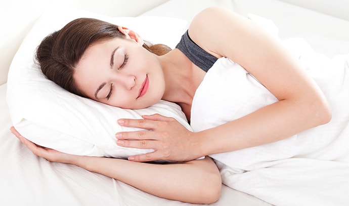 beautiful-young-woman-asleep-white-background