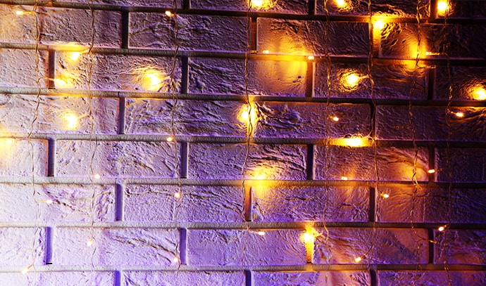 electric-garland-christmas-lights-brick-wall