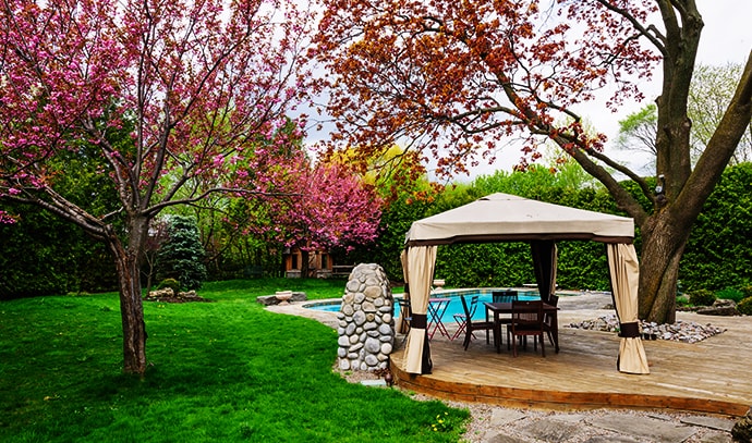 residential-backyard-gazebo-deck-stone-patio-swimming-pool