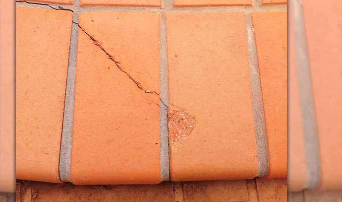 arcbuild-insurance-cracked-brick-floors-damaged-poolside