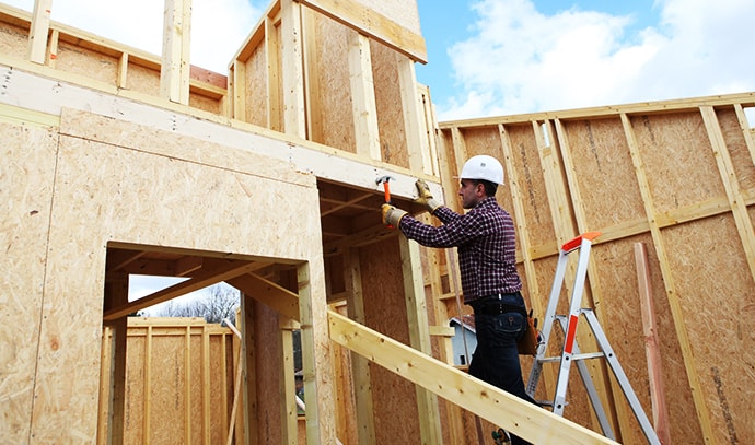 carpenter-at-work-house-construction-site-builder