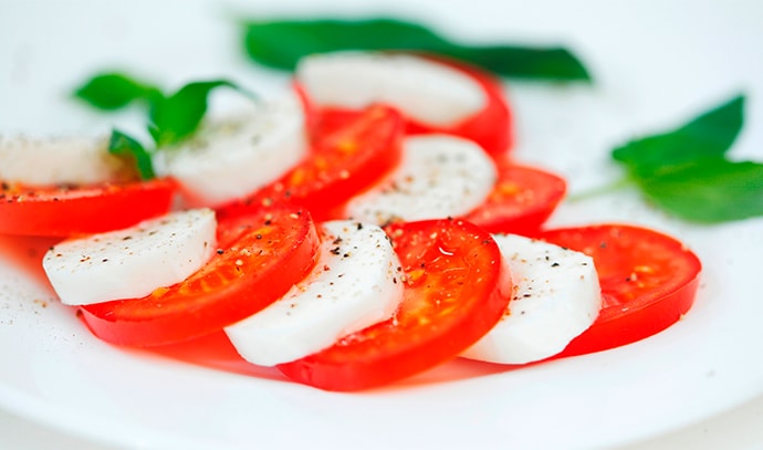tomato-mozzarella-basil-leaves-plate
