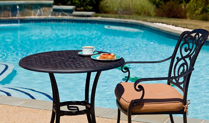 coffee-plate-cast-aluminum-table-single-chair-side-swimming-pool-backyard