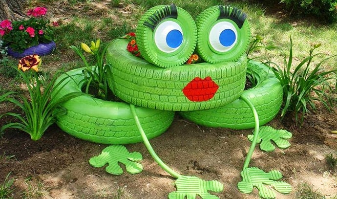 two-women-and-a-hoe-green-painted-tires-flower-plant-pots