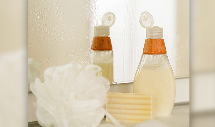 close-up-bathroom-body-care-products-shelf-mirror-reflection