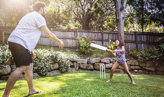 cricket-outdoors-daughter-dad-practicing-bonding