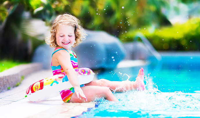 adorable-little-girl-colourful-swimsuit-playing-water-splashes-swimming-pool