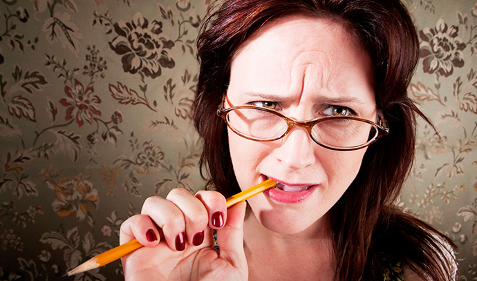 nervous-woman-biting-chewing-pencil