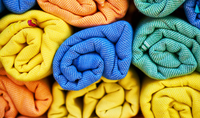 wa-bathrooms-folded-rolled-towels-stack-colourful-selection