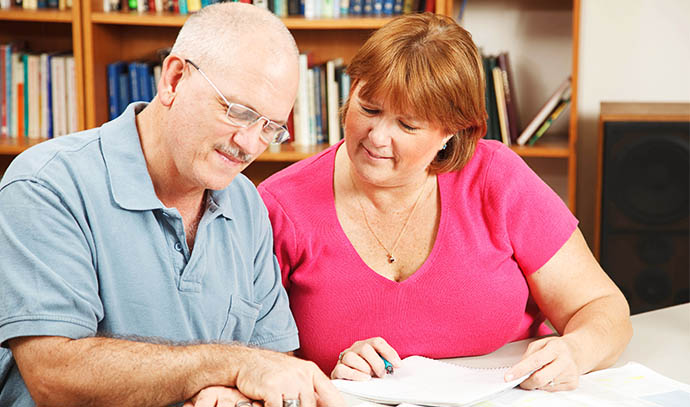 adult-students-couple-studying-together-library-reading-notes