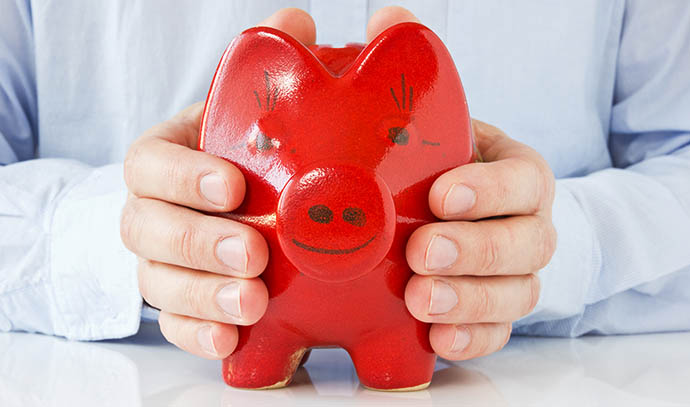 business-man-holding-piggy-bank-coinbank-money-protection