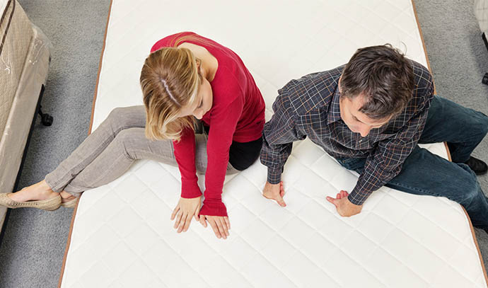 friends-sitting-mattress-furniture-store-buying