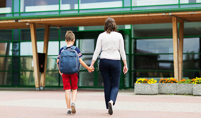 education-childhood-family-people-concept-elementary-student-boy-mother-going-school