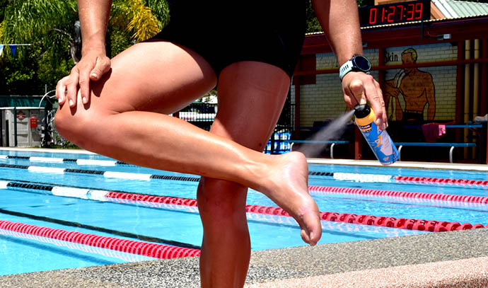 woman-spraying-foot-swimming-pool